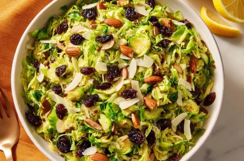 Shredded Brussels Sprout Salad with Raisins and Almonds